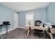 Bright home office with blue walls, modern desk, and a window for natural light at 7838 Chesapeake E Dr, Indianapolis, IN 46236