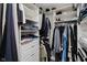 A spacious walk-in closet with built-in shelving and hanging rods provides ample storage at 7838 Chesapeake E Dr, Indianapolis, IN 46236