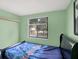 Green bedroom with a large window at 7915 Broadview Dr, Indianapolis, IN 46227