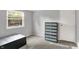 Neutral bedroom with a large window and a chest of drawers at 7915 Broadview Dr, Indianapolis, IN 46227