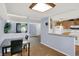 The dining area is connected to the kitchen with a bright atmosphere and hard wood floors at 7915 Broadview Dr, Indianapolis, IN 46227