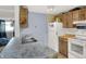 A full view of the kitchen, with butcher block counters, plentiful cabinets, and bright light at 7915 Broadview Dr, Indianapolis, IN 46227
