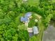Aerial view of the home, deck, fire pit, outbuilding and the pond at 8000 Mcwhorter Rd, Martinsville, IN 46151