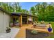 Inviting backyard with a wooden deck, outdoor grill, white rock pathway and plenty of space at 8000 Mcwhorter Rd, Martinsville, IN 46151