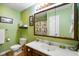 Bathroom with a large mirror, patterned shower curtain, and a neutral color toilet and vanity at 8000 Mcwhorter Rd, Martinsville, IN 46151