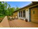Exterior side view of deck with chairs and table outside the front door at 8000 Mcwhorter Rd, Martinsville, IN 46151
