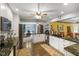 Kitchen with granite countertops, stainless steel appliances, hardwood floors, and white cabinetry at 8000 Mcwhorter Rd, Martinsville, IN 46151