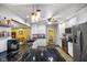Bright kitchen with stainless steel appliances, granite countertops, and white cabinetry at 8000 Mcwhorter Rd, Martinsville, IN 46151