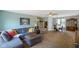 A comfy living room with soft carpet, comfortable furniture, and plenty of light at 8000 Mcwhorter Rd, Martinsville, IN 46151