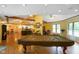 Large living room featuring ceiling fans, hardwood floors, and a pool table at 8000 Mcwhorter Rd, Martinsville, IN 46151