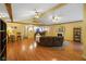 Living room with hardwood floors, a fireplace and view into the kitchen at 8000 Mcwhorter Rd, Martinsville, IN 46151