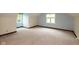 Bedroom featuring three windows providing lots of natural light and carpeted floors at 8465 Hilltop Ln, Martinsville, IN 46151