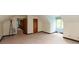 Bedroom features carpeted floors, a large window, and doorways to other rooms at 8465 Hilltop Ln, Martinsville, IN 46151