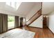 Bright foyer with hardwood floors, stairway, high ceilings, and a large window at 8465 Hilltop Ln, Martinsville, IN 46151
