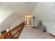 Hallway featuring natural light, wood trim, and doorways to other rooms at 8465 Hilltop Ln, Martinsville, IN 46151
