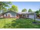 Charming brick home with a well-manicured lawn and inviting curb appeal at 9104 W Lone Beech Dr, Muncie, IN 47304