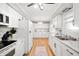 Bright kitchen with white cabinetry, modern appliances, and ample counter space at 9104 W Lone Beech Dr, Muncie, IN 47304