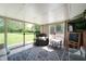 Bright sun room with a sitting area, table and chairs, and an outdoor view at 9104 W Lone Beech Dr, Muncie, IN 47304