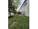 Spacious backyard featuring a small patio with a table and chairs at 9535 Longwell Dr, Indianapolis, IN 46240