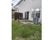 Backyard patio with table and chairs, and sliding door leading to the kitchen at 9535 Longwell Dr, Indianapolis, IN 46240
