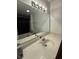 Bathroom vanity featuring a large mirror and well-lit sink area at 9535 Longwell Dr, Indianapolis, IN 46240