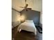 Bedroom featuring a ceiling fan, dresser, and treadmill for exercise at 9535 Longwell Dr, Indianapolis, IN 46240