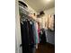 Walk-in closet featuring metal shelving for clothing and storage containers at 9535 Longwell Dr, Indianapolis, IN 46240