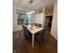 Bright dining area with a modern light fixture and view of the outside greenery at 9535 Longwell Dr, Indianapolis, IN 46240
