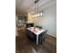 Well-lit dining area leading to a cozy living room with comfortable seating and natural light at 9535 Longwell Dr, Indianapolis, IN 46240