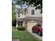 Inviting two-story home with a brick facade, manicured lawn, and an attached single-car garage at 9535 Longwell Dr, Indianapolis, IN 46240