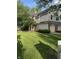 Charming two-story townhome featuring a well-maintained lawn and convenient attached garages at 9535 Longwell Dr, Indianapolis, IN 46240