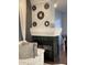 Elegant living room featuring a modern fireplace with decorative mirrors and a comfortable white sofa at 9535 Longwell Dr, Indianapolis, IN 46240