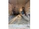 A spacious garage interior with several bicycles and storage items at 9535 Longwell Dr, Indianapolis, IN 46240