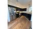 Well-equipped kitchen with stainless steel appliances, dark cabinetry, and functional design at 9535 Longwell Dr, Indianapolis, IN 46240
