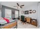 Cozy bedroom with neutral walls, and a comfortable desk for a great workspace at 9689 Wild Iris Dr, Noblesville, IN 46060
