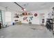 Spacious garage with ample storage shelving and a clean, organized layout at 9689 Wild Iris Dr, Noblesville, IN 46060