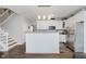 Spacious kitchen featuring a large island, stainless steel appliances, and modern finishes at 9689 Wild Iris Dr, Noblesville, IN 46060