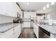 Well-lit kitchen featuring white cabinets, stainless steel appliances, and granite countertops at 9689 Wild Iris Dr, Noblesville, IN 46060