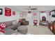 Recreational room with Indiana Hoosier decor, comfortable seating, and ample lighting at 9689 Wild Iris Dr, Noblesville, IN 46060