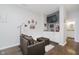 Cozy living area with comfortable seating, wet bar, and access to a bathroom at 9689 Wild Iris Dr, Noblesville, IN 46060