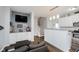 Open-concept living area with a view of the kitchen and stairs, perfect for entertaining at 9689 Wild Iris Dr, Noblesville, IN 46060