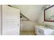 A small bathroom features a sink with drawers and a mirror hanging on the wall at 102 N Whitcomb Ave, Indianapolis, IN 46224