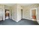 Bedroom with floral wallpaper, closet, and doorways to other rooms at 102 N Whitcomb Ave, Indianapolis, IN 46224