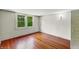 A simple bedroom features a double hung window letting in natural light at 102 N Whitcomb Ave, Indianapolis, IN 46224