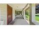 View of the porch with seating, showing the front door at 102 N Whitcomb Ave, Indianapolis, IN 46224