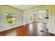 Bright living room featuring a brick fireplace and hardwood floors at 102 N Whitcomb Ave, Indianapolis, IN 46224