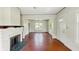 Bright living room featuring a brick fireplace and hardwood floors at 102 N Whitcomb Ave, Indianapolis, IN 46224