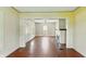 Bright living room featuring a brick fireplace and hardwood floors at 102 N Whitcomb Ave, Indianapolis, IN 46224