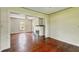 Bright living room featuring a brick fireplace and hardwood floors at 102 N Whitcomb Ave, Indianapolis, IN 46224