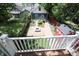 An aerial view of a backyard with a brick patio and a fire pit, surrounded by grass and greenery at 1156 Spruce St, Indianapolis, IN 46203